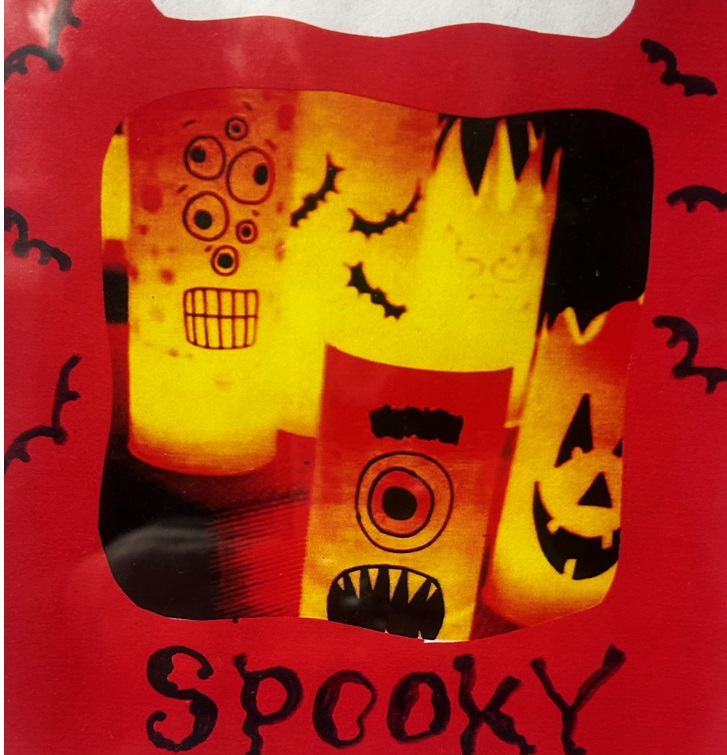 Illuminated cylinders with Jack-o-Lantern-style faces. Cartoon bats plus the word "Spooky"