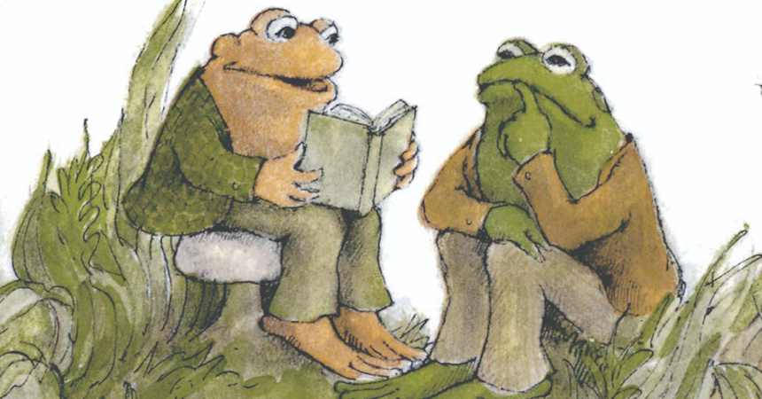 An illustration by Arnold Lobel of Frog and Toad, two anthropomorphic amphibians in blazers and pants. Toad sits on a mushroom reading a book aloud to Frog, who listens with a finger to his lips.