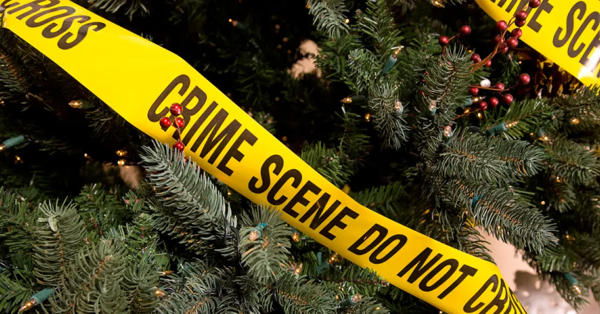 A Christmas tree wrapped in &quot;Crime Scene: Do Not Cross&quot; warning tape.