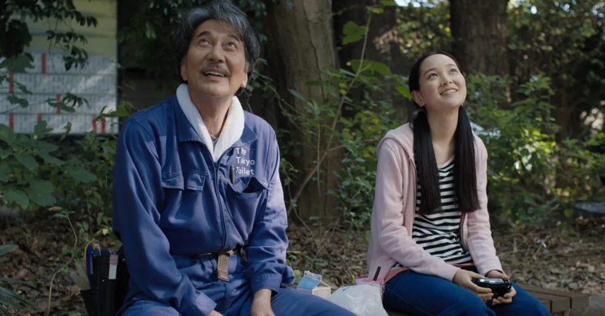 Actors Koji Yakusho and Arisa Nakano look up at the sky with dreamy expressions in a scene from Perfect Days.