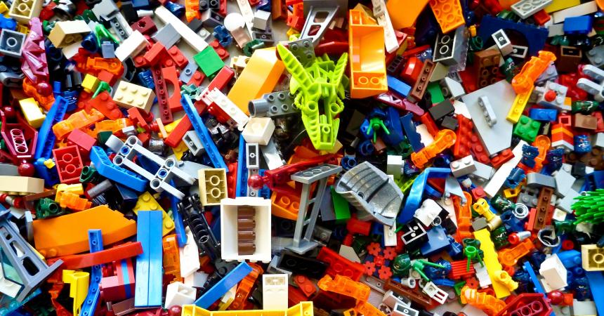 A messy pile of miscellaneous Lego bricks in various shapes and colors.
