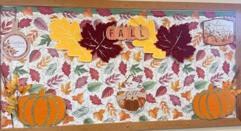 Fall bulletin board with leaves and pumpkins