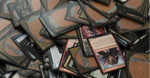 An unsorted, messy pile of loose Magic: the Gathering cards.